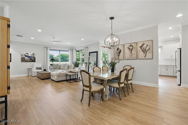 28657 San Lucas Ln Unit 102, Bonita Springs, FL 34135 - dining room with light wood-style floors, crown molding, a chandelier, and recessed lighting