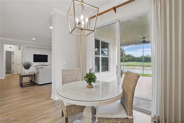 28657 San Lucas Ln Unit 102, Bonita Springs, FL 34135 - dining area with a chandelier, crown molding, light wood-type flooring, and recessed lighting
