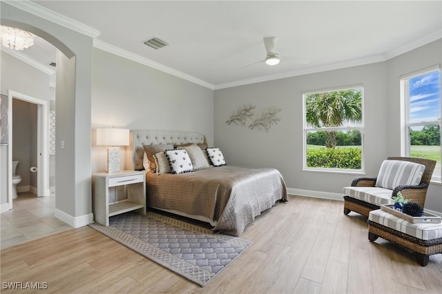 28657 San Lucas Ln Unit 102, Bonita Springs, FL 34135 - bedroom with multiple windows, light wood-type flooring, arched walkways, ornamental molding, and a ceiling fan