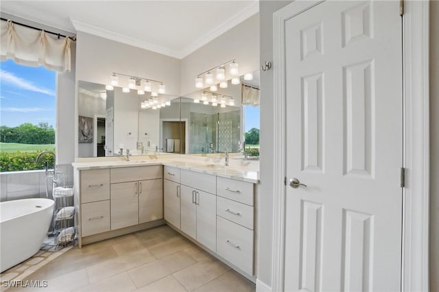 28657 San Lucas Ln Unit 102, Bonita Springs, FL 34135 - full bathroom featuring vanity, healthy amount of natural light, a soaking tub, crown molding, and tile patterned floors