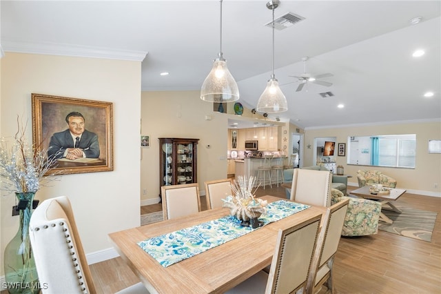 2608 NW 25th Ave, Cape Coral, FL 33993 - dining space featuring crown molding, a ceiling fan, light wood-style flooring, baseboards, and lofted ceiling