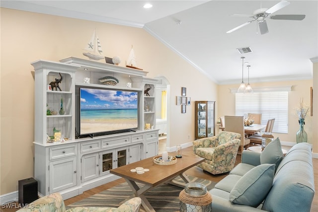 2608 NW 25th Ave, Cape Coral, FL 33993 - living room featuring vaulted ceiling, wood finished floors, ceiling fan, baseboards, and crown molding