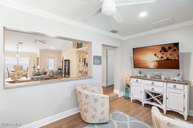 2608 NW 25th Ave, Cape Coral, FL 33993 - living area featuring ceiling fan, crown molding, baseboards, and light wood-style floors