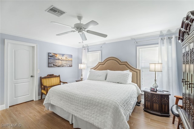 2608 NW 25th Ave, Cape Coral, FL 33993 - bedroom featuring crown molding, multiple windows, light wood-type flooring, and a ceiling fan