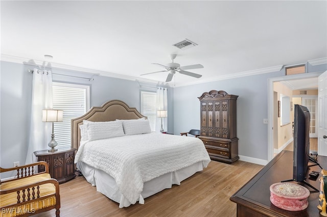 2608 NW 25th Ave, Cape Coral, FL 33993 - bedroom with ornamental molding, light wood-style flooring, ceiling fan, and baseboards