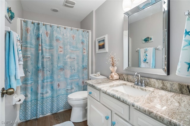 2608 NW 25th Ave, Cape Coral, FL 33993 - bathroom with wood finished floors, vanity, toilet, and curtained shower