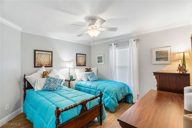 2608 NW 25th Ave, Cape Coral, FL 33993 - bedroom featuring wood finished floors, crown molding, baseboards, and ceiling fan
