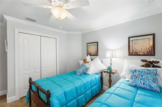 2608 NW 25th Ave, Cape Coral, FL 33993 - bedroom with wood finished floors, a closet, ornamental molding, baseboards, and ceiling fan