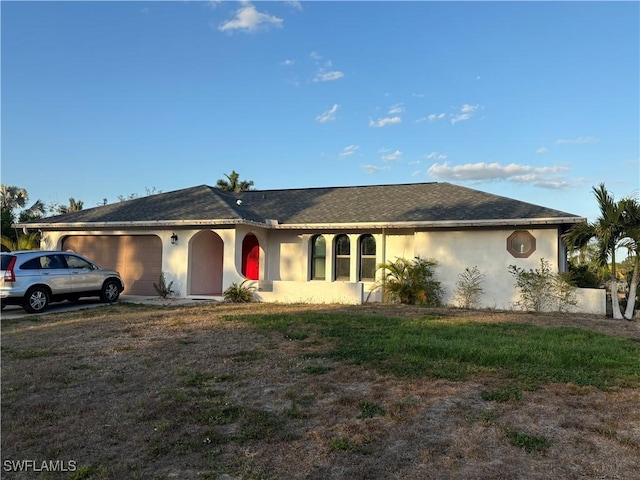 5504 Brookfield St, Lehigh Acres, FL 33971 - single story home featuring an attached garage, stucco siding, and a shingled roof
