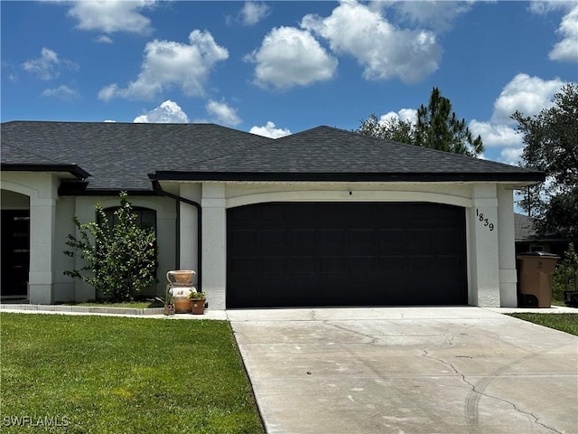 1839 Jovita Ave, Lehigh Acres, FL 33972 - view of front of property featuring concrete driveway, a garage, and stucco siding