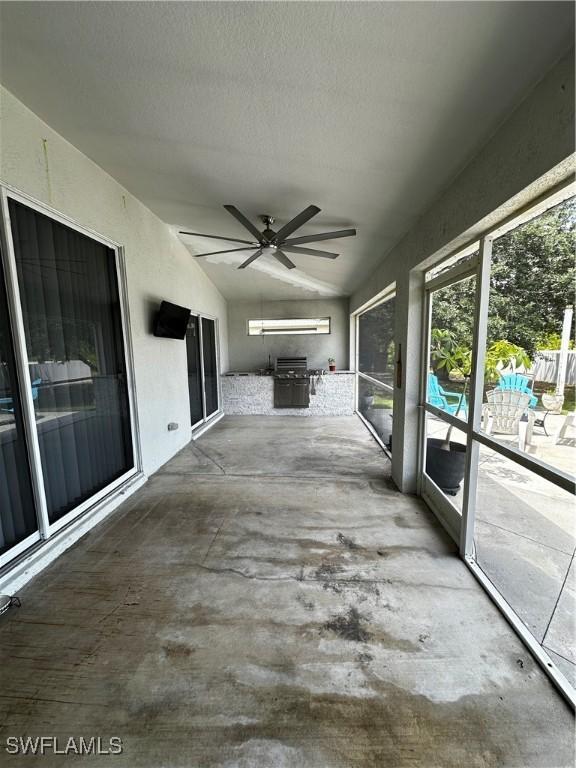 1839 Jovita Ave, Lehigh Acres, FL 33972 - unfurnished sunroom with lofted ceiling and ceiling fan