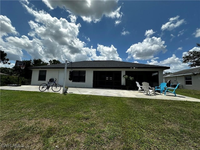 1839 Jovita Ave, Lehigh Acres, FL 33972 - back of property with a patio area, a yard, and a garage