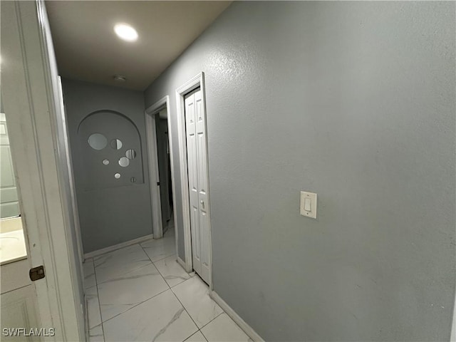 1839 Jovita Ave, Lehigh Acres, FL 33972 - hall featuring light marble finish floors and baseboards
