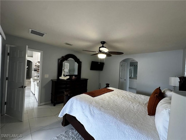 1839 Jovita Ave, Lehigh Acres, FL 33972 - bedroom with arched walkways, light marble finish flooring, and ceiling fan