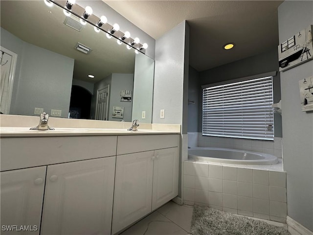 1839 Jovita Ave, Lehigh Acres, FL 33972 - full bathroom with double vanity, a bath, and marble finish floors