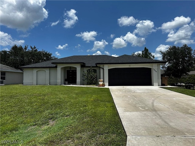 1839 Jovita Ave, Lehigh Acres, FL 33972 - ranch-style house featuring a garage, a front lawn, and stucco siding