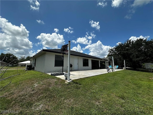 1839 Jovita Ave, Lehigh Acres, FL 33972 - rear view of property featuring a patio, a yard, stucco siding, and cooling unit