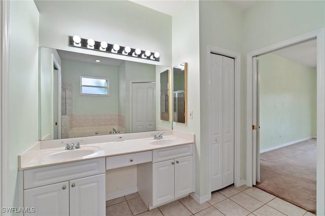 25941 Pebblecreek Dr, Bonita Springs, FL 34135 - full bathroom with a closet, double vanity, tile patterned floors, a garden tub, and baseboards