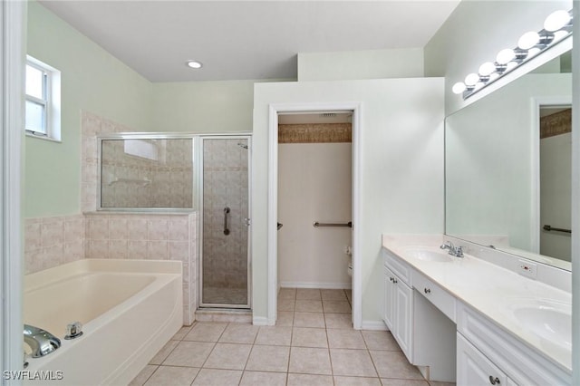 25941 Pebblecreek Dr, Bonita Springs, FL 34135 - full bath with a garden tub, double vanity, tile patterned flooring, a stall shower, and toilet
