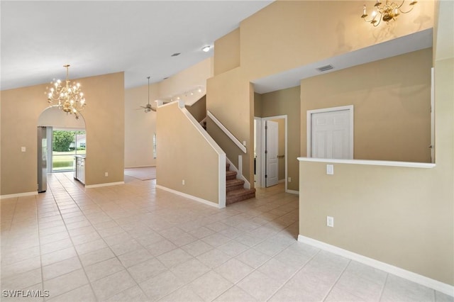 25941 Pebblecreek Dr, Bonita Springs, FL 34135 - empty room with a chandelier, high vaulted ceiling, light tile patterned floors, and stairway
