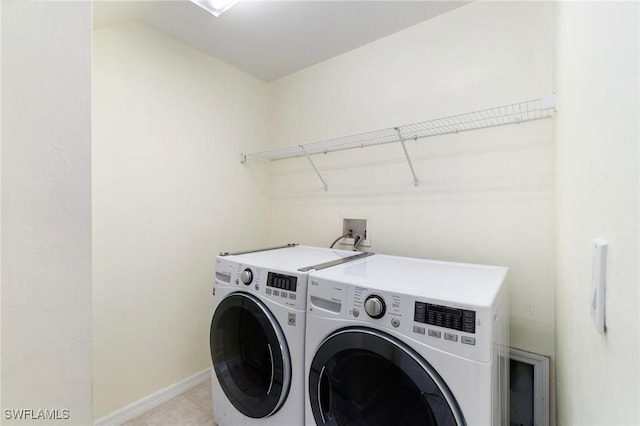 25941 Pebblecreek Dr, Bonita Springs, FL 34135 - washroom with washing machine and dryer and baseboards