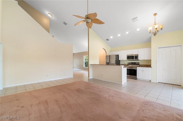 25941 Pebblecreek Dr, Bonita Springs, FL 34135 - unfurnished living room featuring light tile patterned flooring, high vaulted ceiling, light carpet, a ceiling fan, and a chandelier