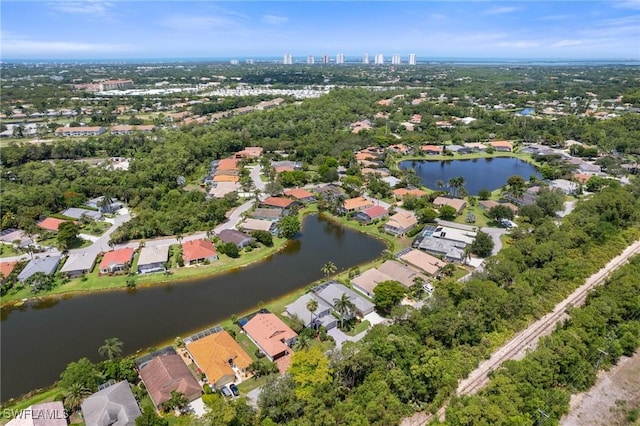 25941 Pebblecreek Dr, Bonita Springs, FL 34135 - aerial view of property's location with a nearby body of water, nearby suburban area, and a tree filled landscape