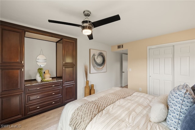 6142 Whiskey Creek Dr Unit 628, Fort Myers, FL 33919 - bedroom featuring a closet, light wood-style flooring, and ceiling fan