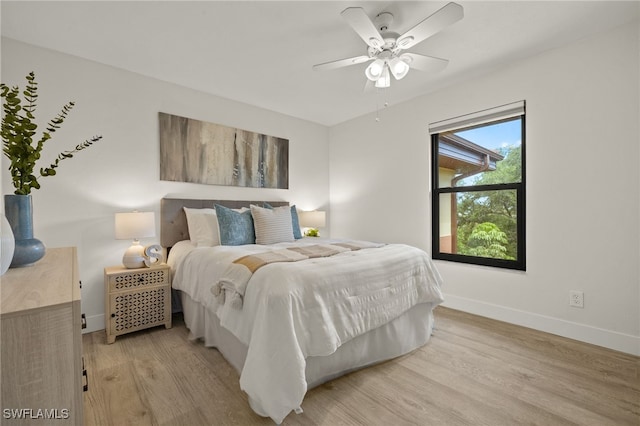 6142 Whiskey Creek Dr Unit 628, Fort Myers, FL 33919 - bedroom featuring light wood-style flooring, baseboards, and ceiling fan