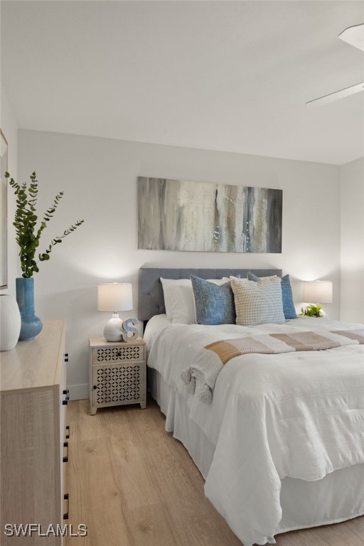 6142 Whiskey Creek Dr Unit 628, Fort Myers, FL 33919 - bedroom featuring light wood-type flooring and baseboards