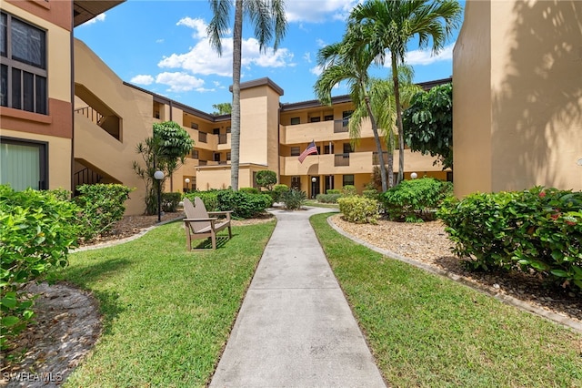 6142 Whiskey Creek Dr Unit 628, Fort Myers, FL 33919 - surrounding community featuring a lawn