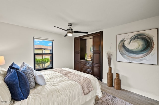 6142 Whiskey Creek Dr Unit 628, Fort Myers, FL 33919 - bedroom featuring light wood-style flooring, baseboards, and ceiling fan