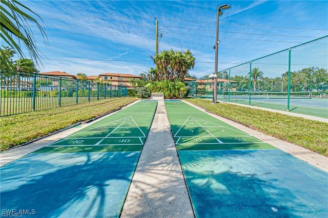 6142 Whiskey Creek Dr Unit 628, Fort Myers, FL 33919 - surrounding community featuring shuffleboard and a tennis court