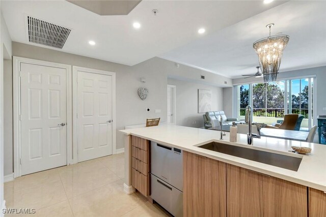 2728 Tiburon Blvd E Unit A403, Naples, FL 34109 - kitchen featuring a sink, dishwasher, modern cabinets, open floor plan, and light countertops