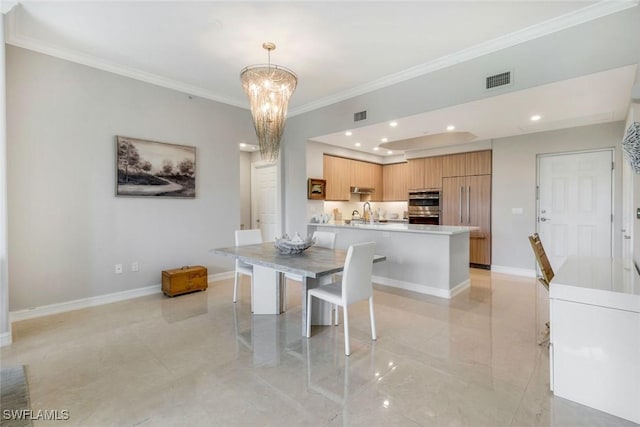 2728 Tiburon Blvd E Unit A403, Naples, FL 34109 - dining space featuring ornamental molding, a chandelier, baseboards, recessed lighting, and light tile patterned floors