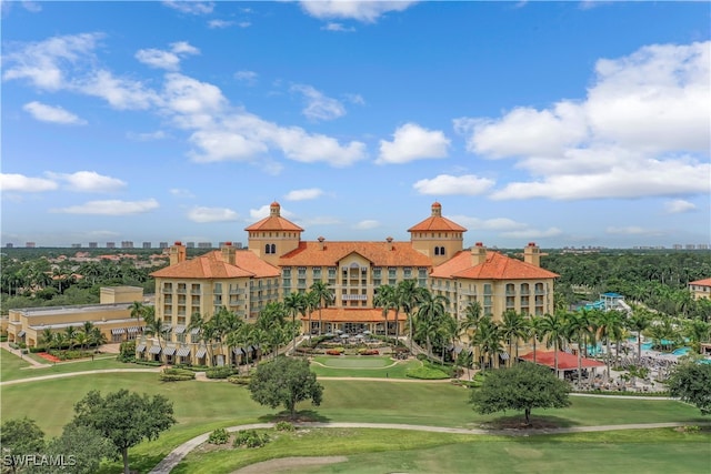 2728 Tiburon Blvd E Unit A403, Naples, FL 34109 - view of property's community with view of golf course and a yard