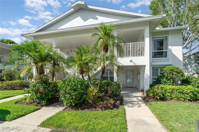 1160 Sarah Jean Cir Unit D204, Naples, FL 34110 - view of front of home featuring stucco siding