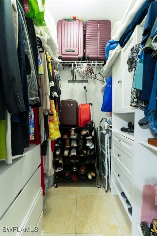 2140 8th St NE, Naples, FL 34120 - spacious closet with light tile patterned floors