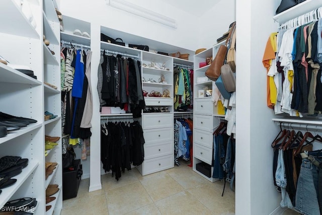 2140 8th St NE, Naples, FL 34120 - spacious closet with light tile patterned floors
