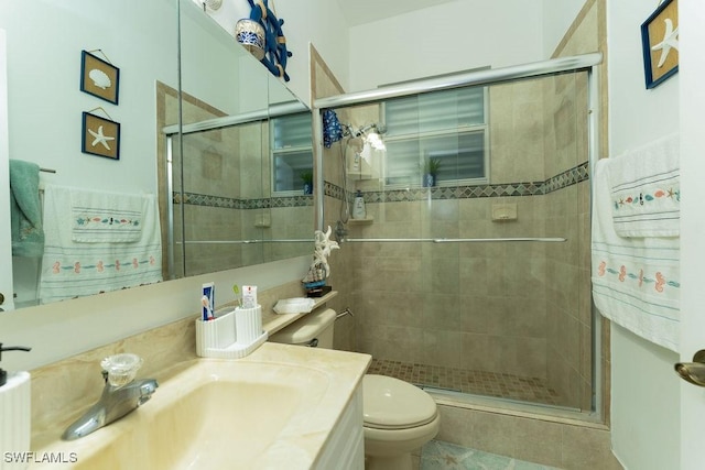 2140 8th St NE, Naples, FL 34120 - bathroom featuring toilet, vanity, and a stall shower