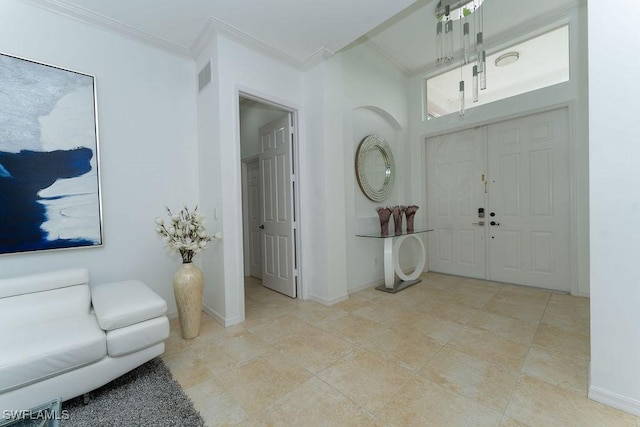 2140 8th St NE, Naples, FL 34120 - entryway featuring crown molding and baseboards