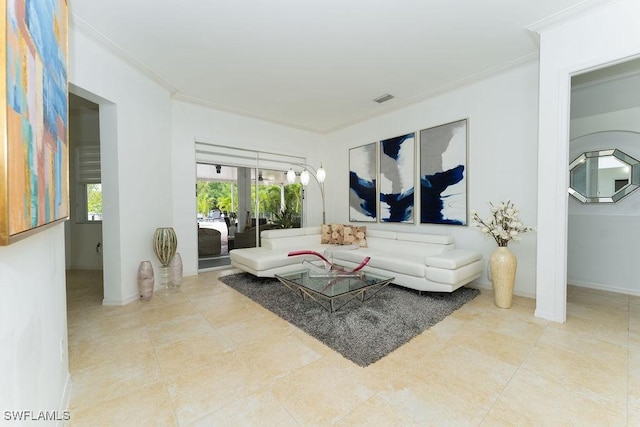 2140 8th St NE, Naples, FL 34120 - living room featuring ornamental molding, baseboards, and tile patterned flooring