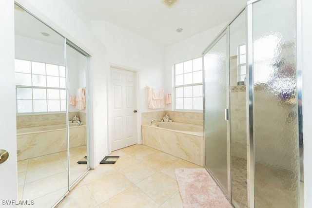 2140 8th St NE, Naples, FL 34120 - bathroom with a garden tub, a stall shower, and tile patterned floors