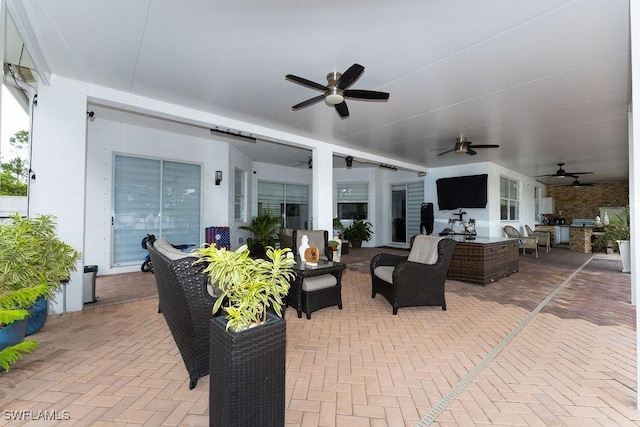 2140 8th St NE, Naples, FL 34120 - view of patio featuring ceiling fan and an outdoor living space