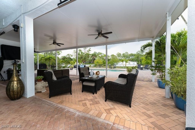 2140 8th St NE, Naples, FL 34120 - view of patio with a ceiling fan, an outdoor pool, and an outdoor hangout area