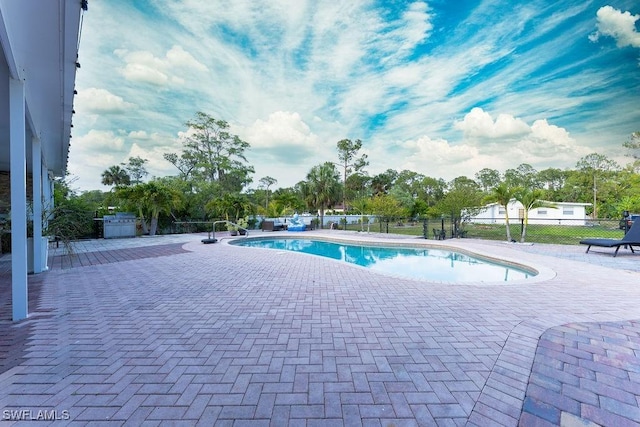 2140 8th St NE, Naples, FL 34120 - view of swimming pool featuring a patio area