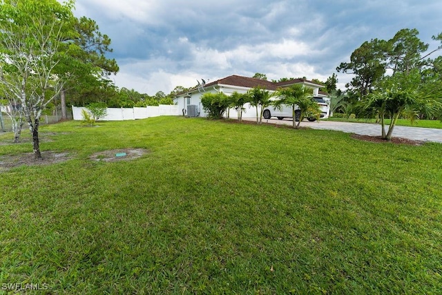 2140 8th St NE, Naples, FL 34120 - view of yard featuring driveway and cooling unit