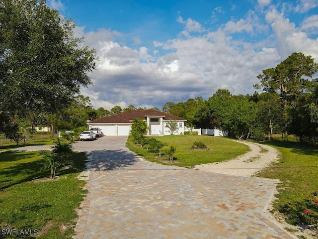 2140 8th St NE, Naples, FL 34120 - ranch-style home with driveway and a front lawn