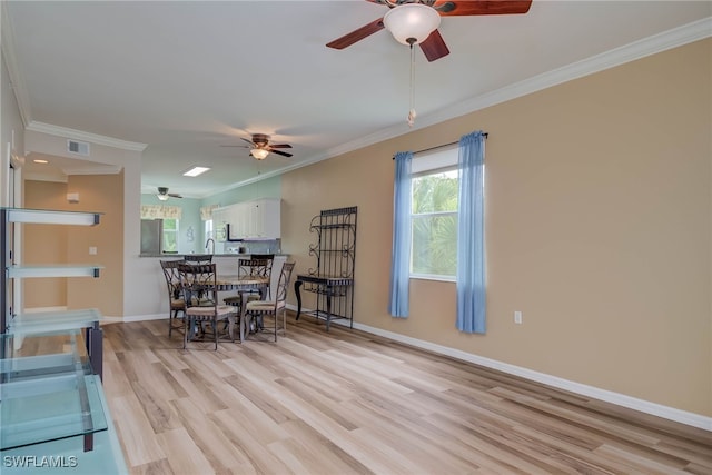 8320 Whiskey Preserve Cir Unit 321, Fort Myers, FL 33919 - dining room featuring ceiling fan, light wood-type flooring, crown molding, and baseboards