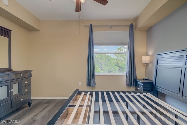 8320 Whiskey Preserve Cir Unit 321, Fort Myers, FL 33919 - unfurnished bedroom featuring wood finished floors, baseboards, and a ceiling fan